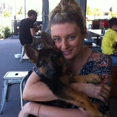 german-shepherd-puppy-getting-cuddles-from-mum